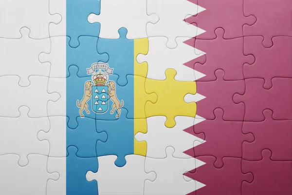 Puzzle con la bandiera nazionale delle isole canarie e qatar — Foto Stock