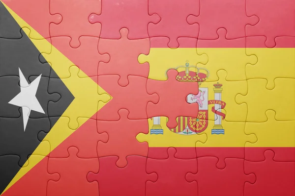 Puzzle with the national flag of spain and east timor — Stock Photo, Image