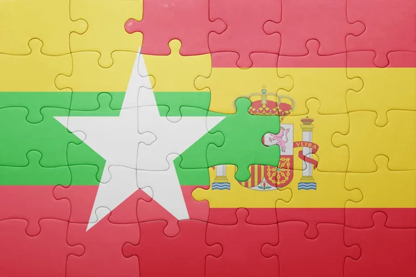 Puzzle s národní vlajkou Španělska a myanmar — Stock fotografie