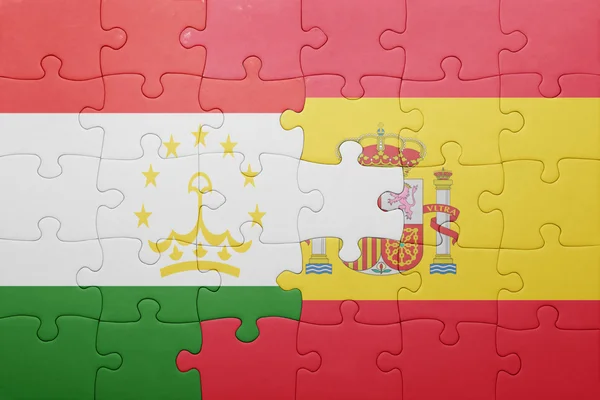 Palapeli Espanjan ja Tajikistanin lippu — kuvapankkivalokuva