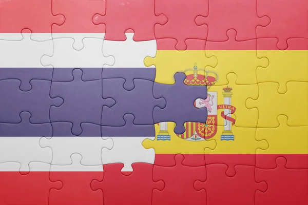 Puzzle with the national flag of spain and thailand — Stock Photo, Image