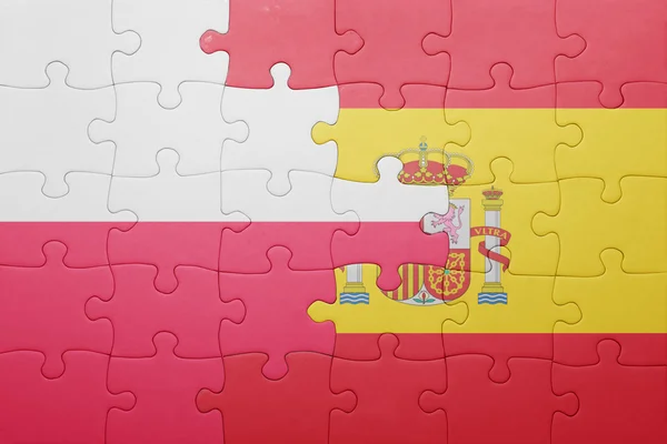 Puzzle with the national flag of spain and poland — Stock Photo, Image