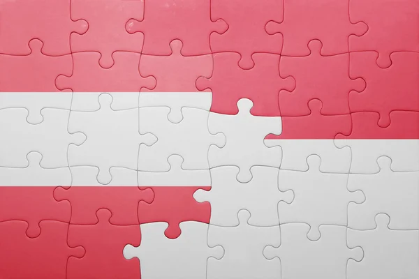 Puzzle s národní vlajka Indonésie a Rakouska — Stock fotografie