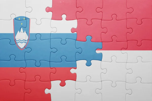 Puzzle with the national flag of indonesia and slovenia — Stock Photo, Image