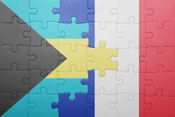 Головоломка з національним прапором Багамських Островів і Франції — стокове фото