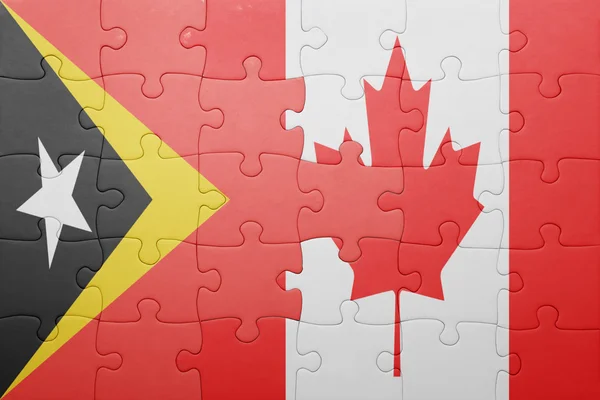 Pussel med den nationella flaggan av Kanada och Östtimor — Stockfoto