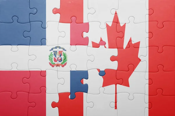 Puzzle avec le drapeau national du Canada et de la République dominicaine — Photo