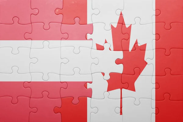 Puzzle con la bandiera nazionale del Canada e dell'Austria — Foto Stock