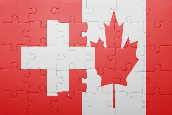 Puzzle con la bandiera nazionale del Canada e della Svizzera — Foto Stock