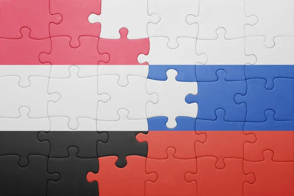 Puzzle s národní vlajkou Jemenu a Ruska — Stock fotografie