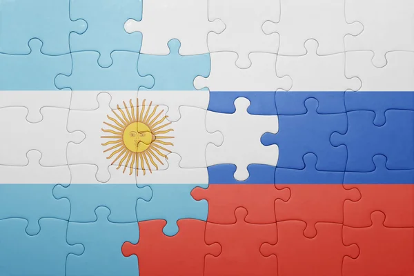 Rompecabezas con la bandera nacional de Argentina y Rusia —  Fotos de Stock
