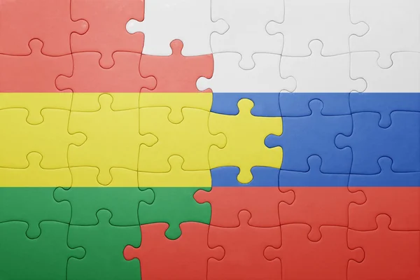Puzzle with the national flag of bolivia and russia — Stock Photo, Image