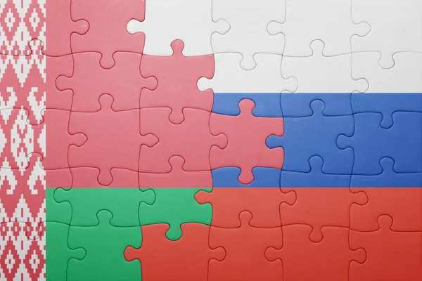 Puzzle con la bandiera nazionale di Bielorussia e Russia — Foto Stock