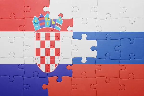 Quebra-cabeça com a bandeira nacional da croácia e da Rússia — Fotografia de Stock