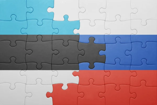 Puzzle with the national flag of estonia and russia — Stock Photo, Image