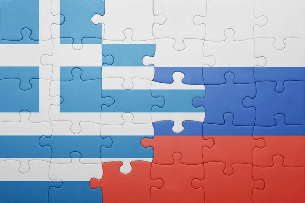 Puzzle with the national flag of greece and russia — Stock Photo, Image