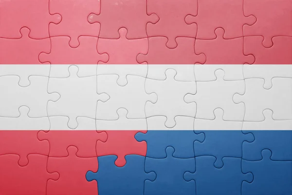Puzzle s národní vlajkou Nizozemska a Rakouska — Stock fotografie