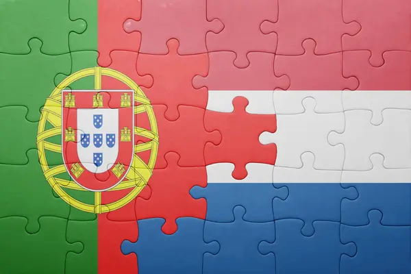 Puzzle z Flaga narodowa Holandii i Portugalii — Zdjęcie stockowe