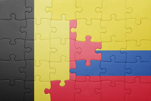 Puzzle mit der Nationalflagge von Kolumbien und Belgien — Stockfoto
