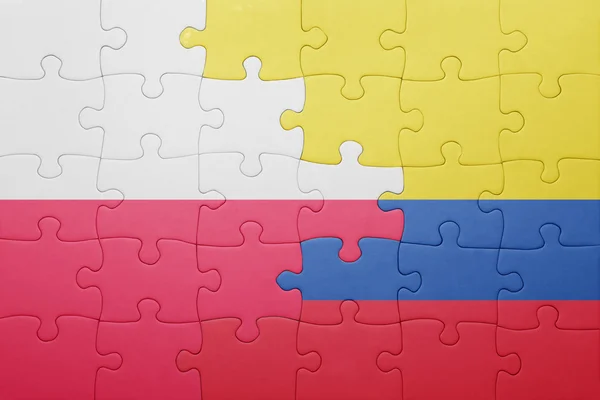 Puzzle mit der Nationalflagge von Kolumbien und Polen — Stockfoto