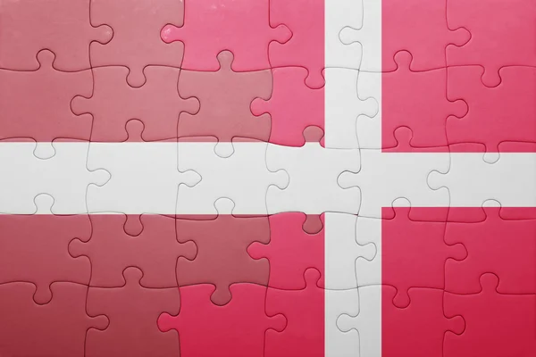 Puzzle with the national flag of latvia and denmark — Stock Photo, Image
