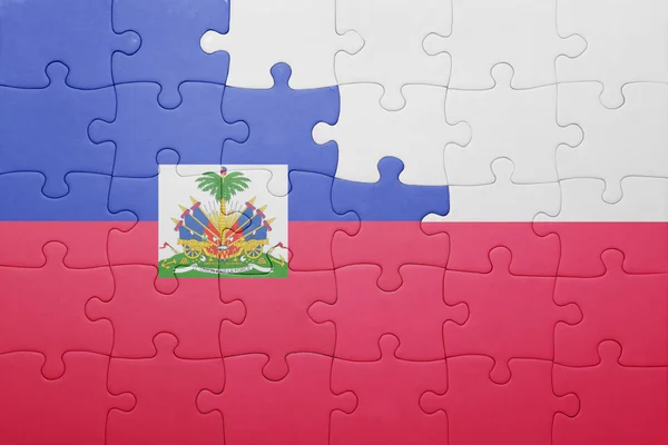 Puzzle with the national flag of haiti and poland — Stock Photo, Image