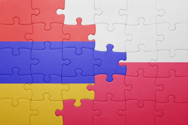 Puzzle con la bandiera nazionale di armenia e Polonia — Foto Stock