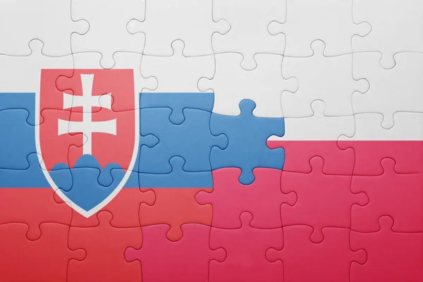 Puzzle s národní vlajkou Slovenska a Polska — Stock fotografie