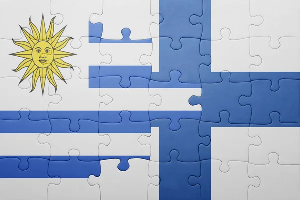 Puzzle with the national flag of uruguay and finland — Stock Photo, Image