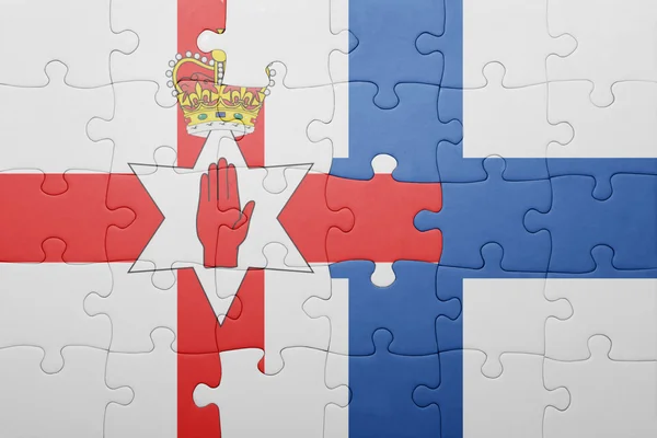 Puzzle with the national flag of northern ireland and finland — Stock Photo, Image