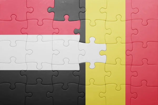 Puzzle com a bandeira nacional do Iémen e da Bélgica — Fotografia de Stock