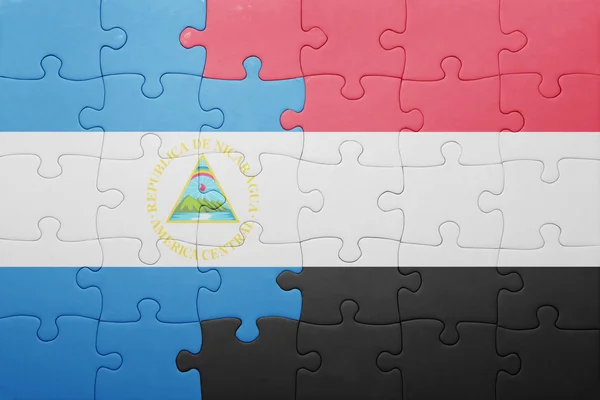 Головоломка з Національний прапор Нікарагуа і Ємен — стокове фото