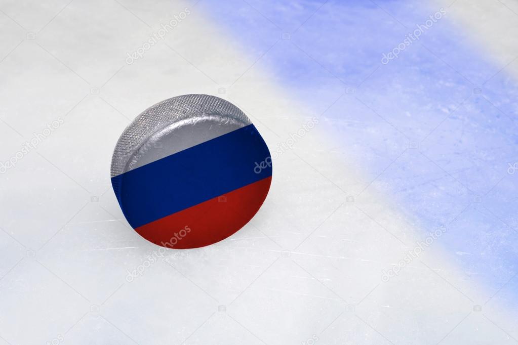 vintage old hockey puck with russian flag