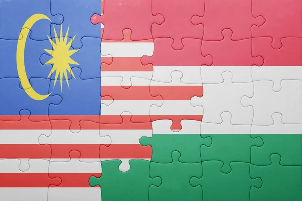 Puzzle with the national flag of malaysia and hungary — Stock Photo, Image