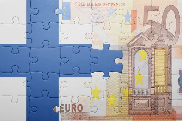 Puzzle with the national flag of finland and euro banknote — Stock Photo, Image