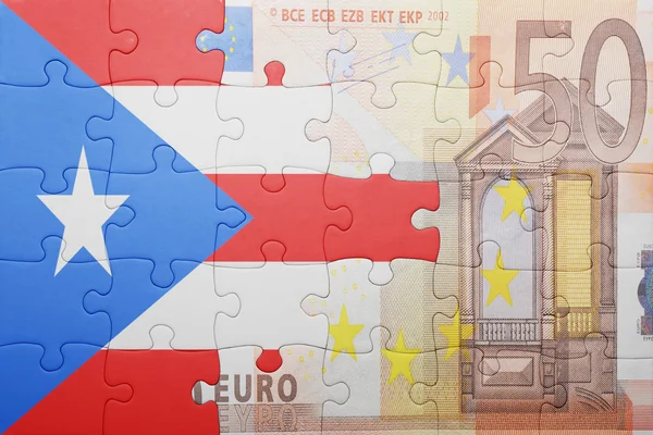 Puzzle mit der Nationalflagge von Puerto Rico und Euro-Banknote — Stockfoto