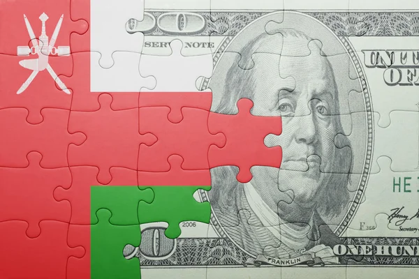 Puzzle s národní vlajka Ománu a dolar bankovek — Stock fotografie