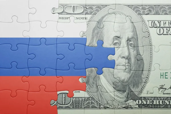 Puzzle s národní vlajka Ruska a dolar bankovek — Stock fotografie