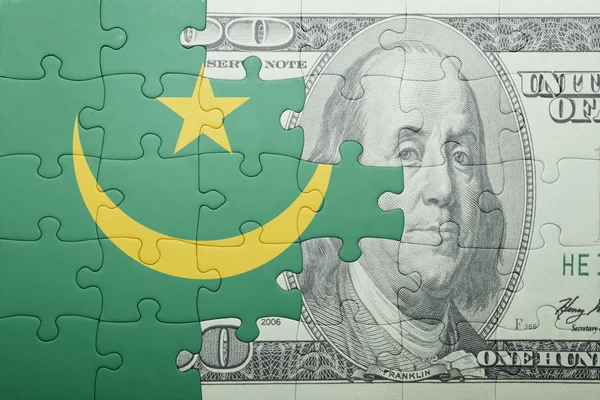 Головоломка з національним прапором Мавританії та доларовою банкнотою — стокове фото