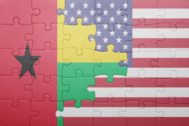 puzzle with the national flag of united states of america and guinea bissau 