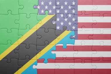 puzzle with the national flag of united states of america and tanzania 