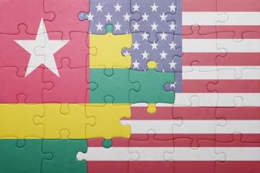 puzzle with the national flag of united states of america and togo 