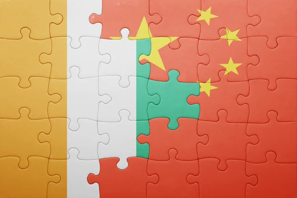 Puzzle with the national flag of china and cote divoire — Stock Photo, Image