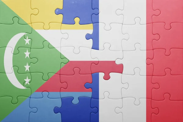 Puzzle with the national flag of comoros and france — Stock Photo, Image