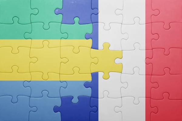 Puzzle avec le drapeau national du Gabon et de la France — Photo