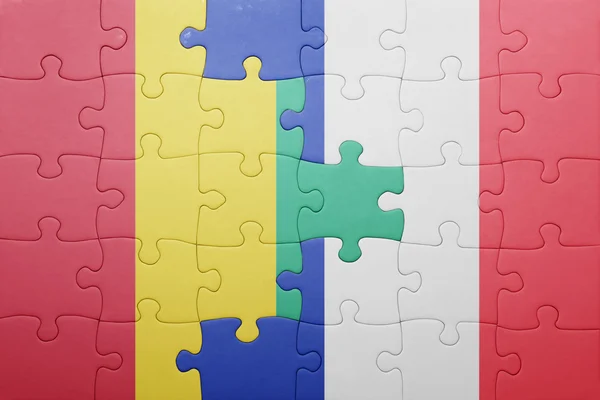 Puzzel met de nationale vlag van Guinee en Frankrijk — Stockfoto