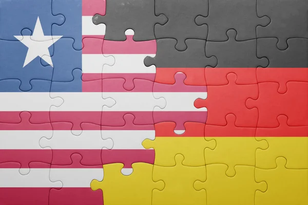 Puzzle with the national flag of germany and liberia — Stock Photo, Image