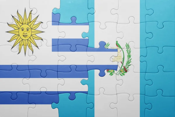 Puzzle with the national flag of guatemala and uruguay — Stock Photo, Image