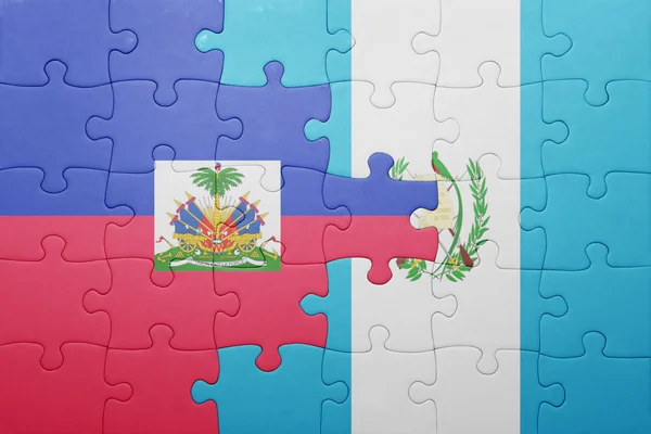 Rompecabezas con la bandera nacional de guatemala y haiti — Foto de Stock