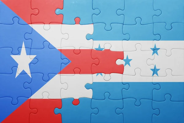 Puzzel met de nationale vlag van honduras en puerto rico — Stockfoto